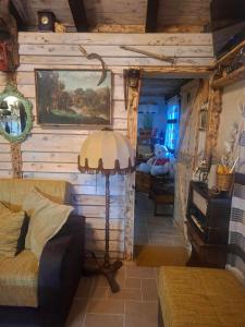 a living room with a couch and a table at Etno House Šćepanov Hlad in Virpazar