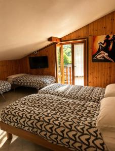 a bedroom with a bed and a television in it at La Scaletta in San Colombano
