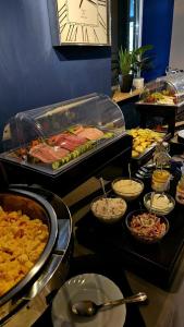 a buffet line with many different types of food at Pension Zeitlos in Potsdam