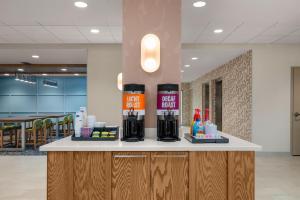 a counter in a hospital lobby with complimentary cosmetics at Hampton Inn By Hilton Lawrenceburg in Lawrenceburg