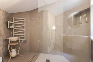 a bathroom with a shower and a glass door at IseoLakeRental - Nido Belvedere in Fonteno +33 photos