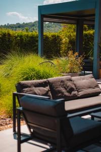 a couch sitting on top of a patio at Green Life Sozopol Antares in Sozopol