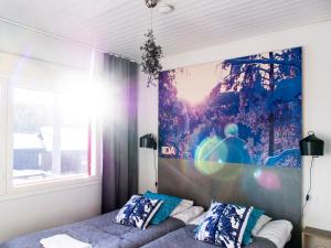 Postel nebo postele na pokoji v ubytování Haapala Suites entinen IIDA Vuokatti