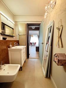 a bathroom with a sink and a mirror at Moft Loft. Lovely, comfy apartment. in Cluj-Napoca