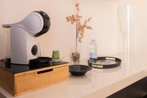 a kitchen counter with a lamp and a bowl on it at Resid Enza Palazzo Sciacca in Patti
