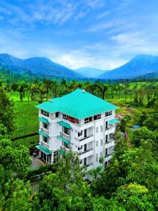 an overhead view of a building with a green roof at Lumino Winter Castle, Munnar in Pooppara