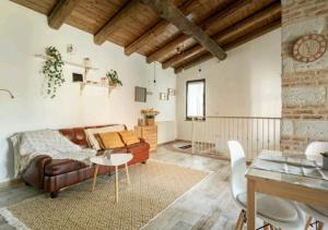 a living room with a couch and a table at Holiday Home Camino Monferrato in Camino