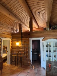 a room with wooden walls and a wooden ceiling at Neset Skydsstasjon in Flesberg +105 photos