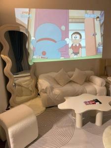 a childs room with a bed and a table at Bảo Châm Homestay in Gia Lâm Pho +3 photos
