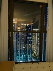 a view of a city skyline from a window at Bảo Châm Homestay in Gia Lâm Pho
