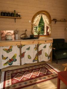 a kitchen with a counter with butterflies on it at Stativa Przygorze201 Sowie Góry in Przygórze