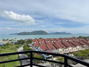 a view from a balcony of buildings and the water at Langkawi Simfoni Beliza Apartment with Sky Pool by Zervin in Kuah
