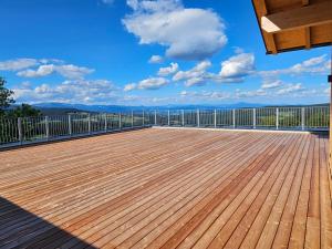 a deck with a view of the mountains at Packerhöhe in Pack