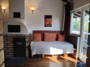 a bedroom with a bed and a fireplace at Quinta do Paraiso in São Teotónio