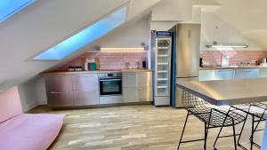 a kitchen with a table and chairs in a room at STACEY Alster in Hamburg +7 photos