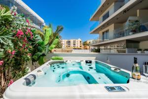 a hot tub on the balcony of a building at Luxurious Two Bed in Torrox