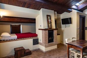 a bedroom with a bed and a fireplace at Agriturismo La Filomena in Montefortino