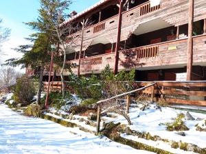a building with snow in front of it at Heidi Montelivata in Subiaco