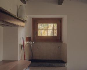 a bathroom with a window and a shower at Casetta dalle finestre rosse in Bedonia +45 photos