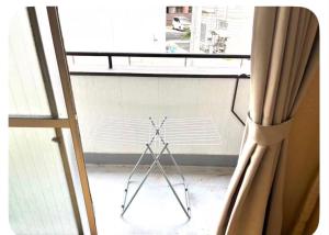 a stand in a room next to a window at パールビル201 in Osaka