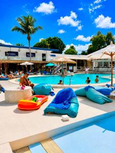 a swimming pool with many inflatables in a resort at Combo Beach Hotel Samui in Chaweng