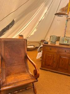 a room with a tent with a chair and a table at The Pip and Lantern in Rye