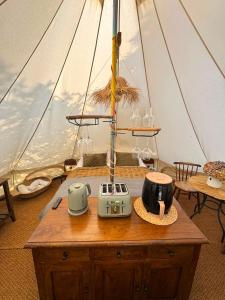 a wooden table in a sailboat with a radio at The Pip and Lantern in Rye