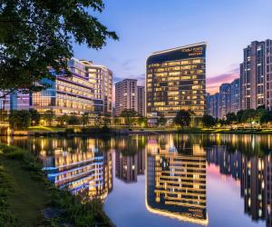 a city skyline with buildings and a river at Four Points by Sheraton Fuzhou Changle in Fuzhou