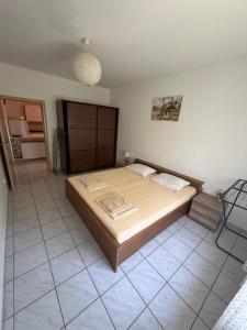 a bedroom with a large bed in a room at VODICE KRAJE APARTMENTS in Vodice +55 photos