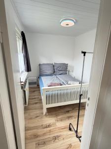 a small bedroom with a bed in a room at Room in Rendsburg in Rendsburg