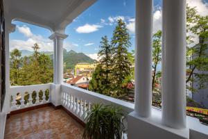 a balcony with a view of a city at Lacasa Sapa Hotel in Sapa