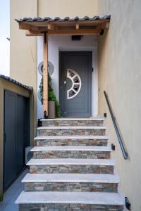 a set of stairs leading up to a door at Casa Maria-Anneta in Kalives Poligirou