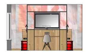 a room with a tv and two red barrels at N4 - Apartments Fulda Free Parking & Zentral in Fulda +8 photos