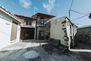 a house in the middle of a street at La casa del Mayoral in Tremedal