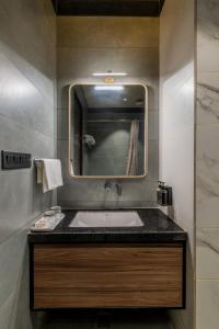 a bathroom with a sink and a mirror at Hotel Highway King Dhodsar in Gūdha