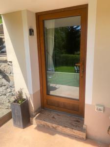 a wooden door with a window on a house at Počitniška hiša Lily in Idrija