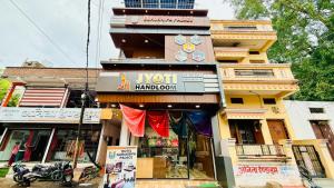 a building with a sign on the front of it at Hotel Gurukripa Palace in Maheshwar