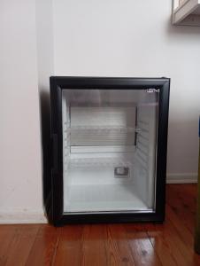 an empty refrigerator with its door open in a room at Sunset Otel in Şile