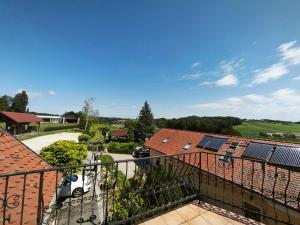 a view from the balcony of a house with solar panels on the roofs at Beli oblaki in Gradišče v Slovenskih Goricah