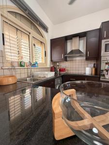 a kitchen with a sink and a counter top at Pearl House in Paralimni