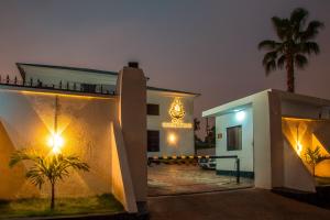 a building with a sign on the side of it at Navy Guest House, Kaduna in Kaduna +11 photos