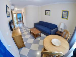 Posedenie v ubytovaní Apartamentos Niña de Oro