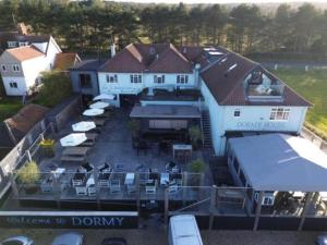 an aerial view of a house with a lot of chairs at The Dormy House Hotel in Cromer