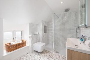 a bathroom with a toilet and a shower and a sink at Eighteen Pottergate in Helmsley +27 photos