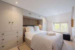 a bedroom with a large bed and a window at Eighteen Pottergate in Helmsley