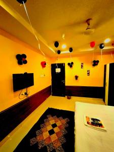 a living room with balloons hanging from the ceiling at Galaxy Stellar Suites in kolkata