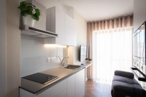 a kitchen with a sink and a counter top at Electra Residence - Central Duplex Penthouse in Marsalforn