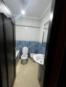 a bathroom with a toilet and a sink at naderi in Tangier