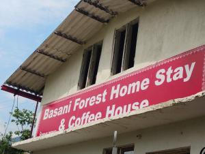 a red sign on the side of a building at Stay in Forest in Haldwāni