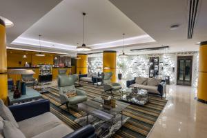 a large living room with couches and chairs at Grand Plaza Hotel - Takhasosi Riyadh in Riyadh
